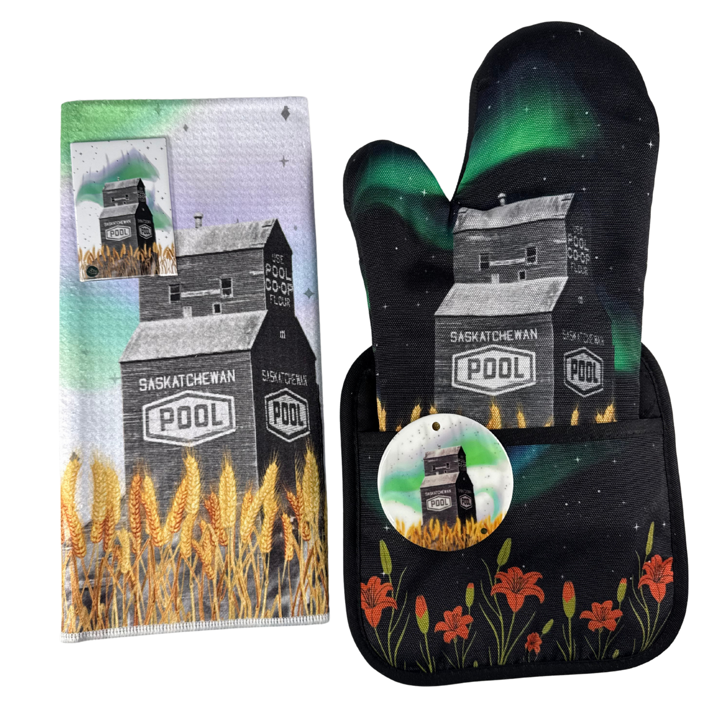Gift set including a tea towel, oven mitt, and ornament featuring a Saskatchewan Pool grain elevator under northern lights.