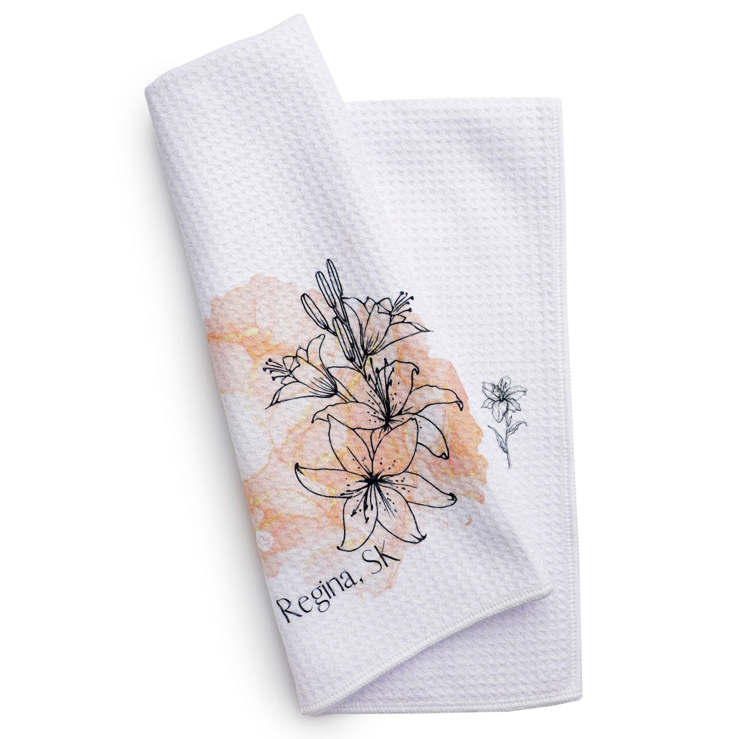 White towel with floral design and 'Regina, SK' text on a white background