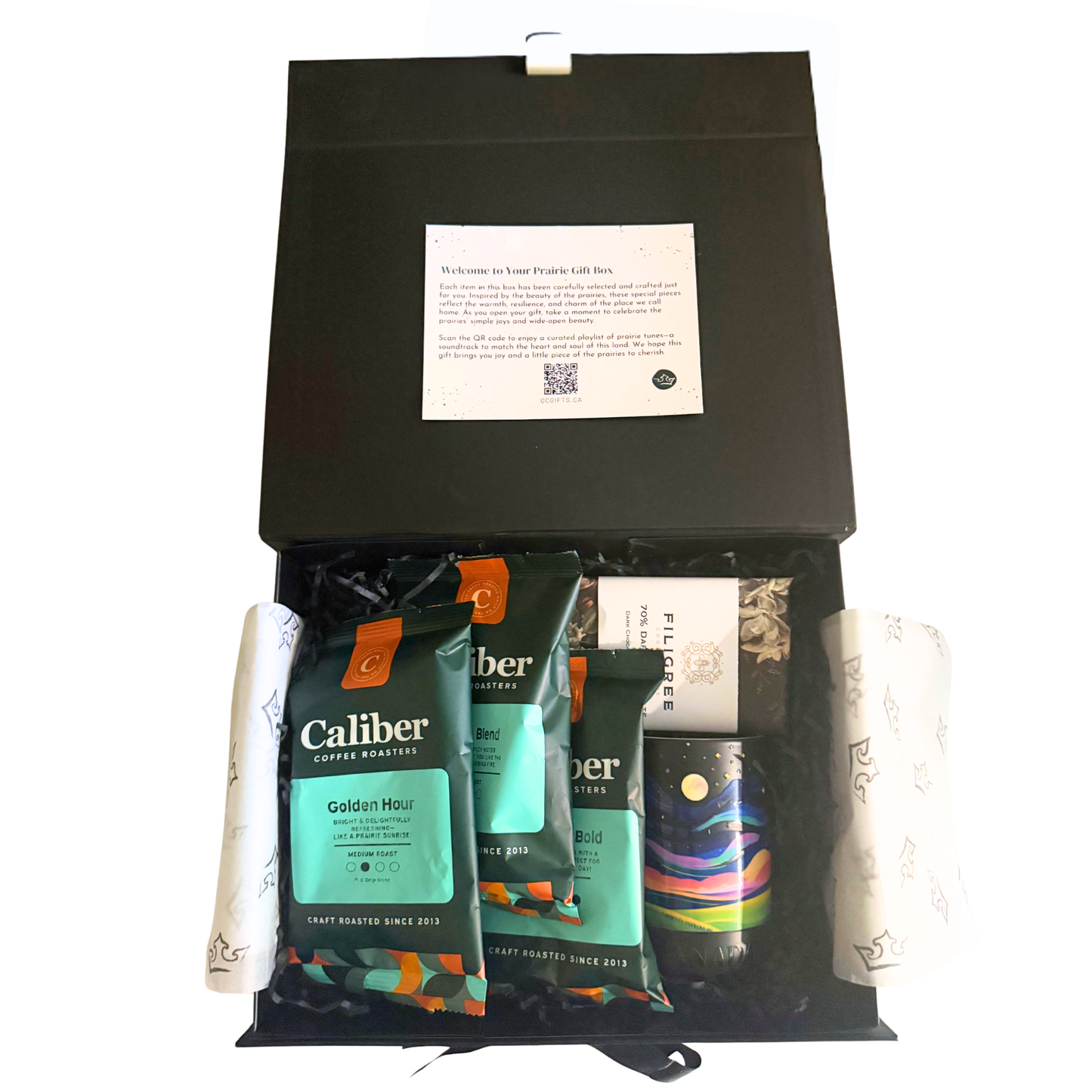 Gift box with Caliber coffee packages and a book inside