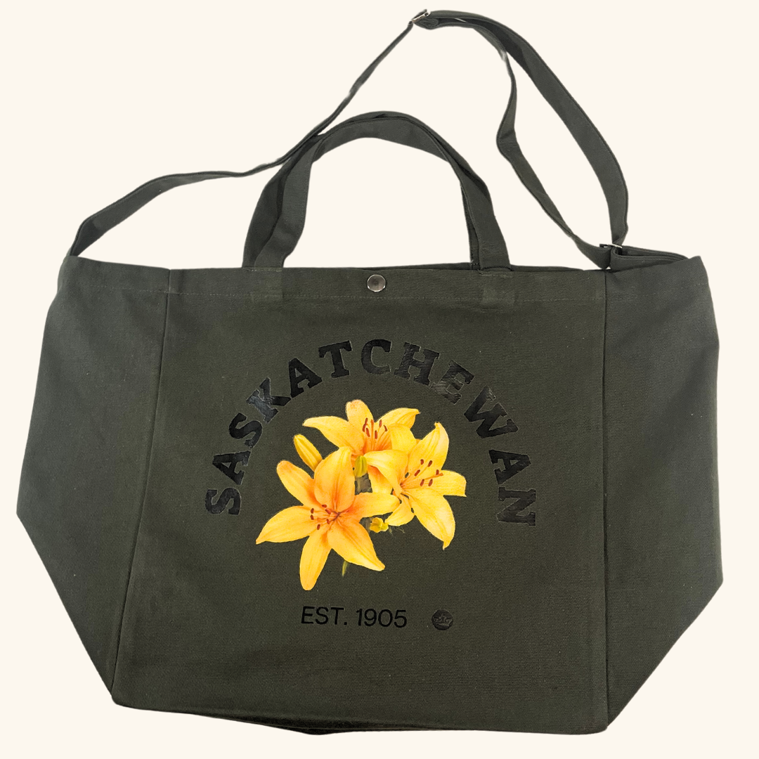 Celebrate the beauty of Saskatchewan with the&nbsp;Prairie Lily Canvas Bag in vibrant green! This stylish and versatile bag is designed to be your go-to companion for everyday errands, outdoor adventures, or as a thoughtful gift for prairie enthusiasts.