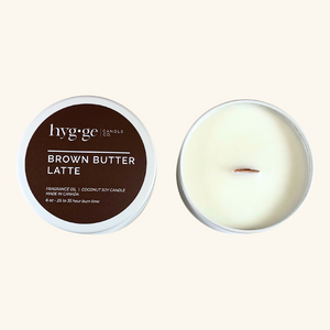 Brown Butter Latte Candle:
6 oz “Brown Butter Latte” coconut soy candle by Hygge Candle Co. in a deep brown tin, with a creamy, warm scent and wood wick.