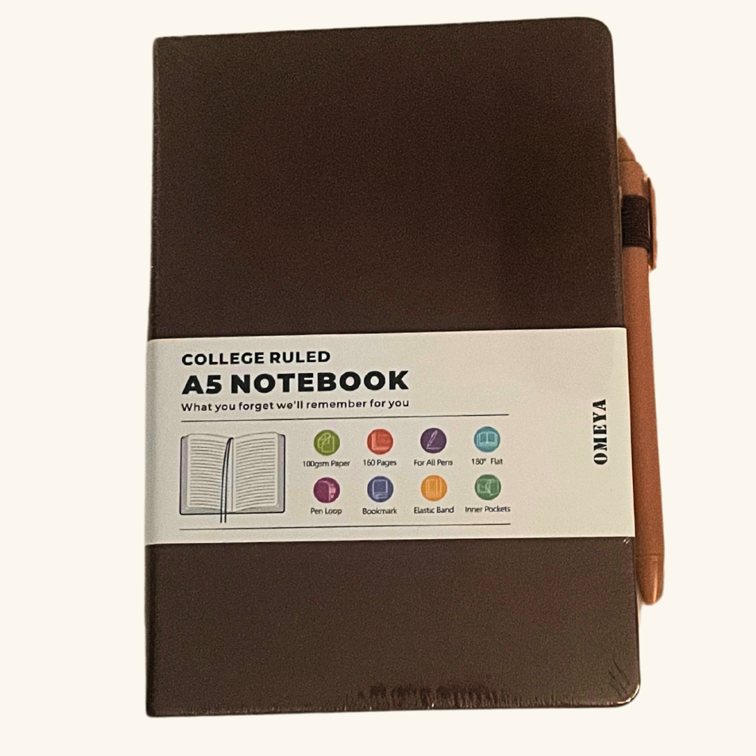 Close-up of brown A5 notebook with pen, showing features like elastic band, pen loop, and premium cover – ideal as a thoughtful gift add-on.