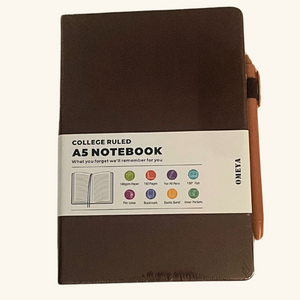 Close-up of brown A5 notebook with pen, showing features like elastic band, pen loop, and premium cover – ideal as a thoughtful gift add-on.