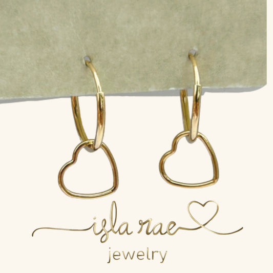 14K gold-filled hoop earrings with dainty heart charm by Isla Rae Jewelry – displayed on neutral background.