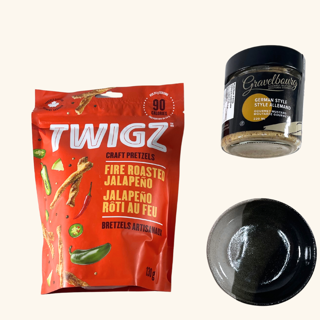 A premium selection of Prairie-made gourmet treats, including artisan pretzel sticks, European-style mustard, and a handmade ceramic dipping bowl for the perfect dipping experience.