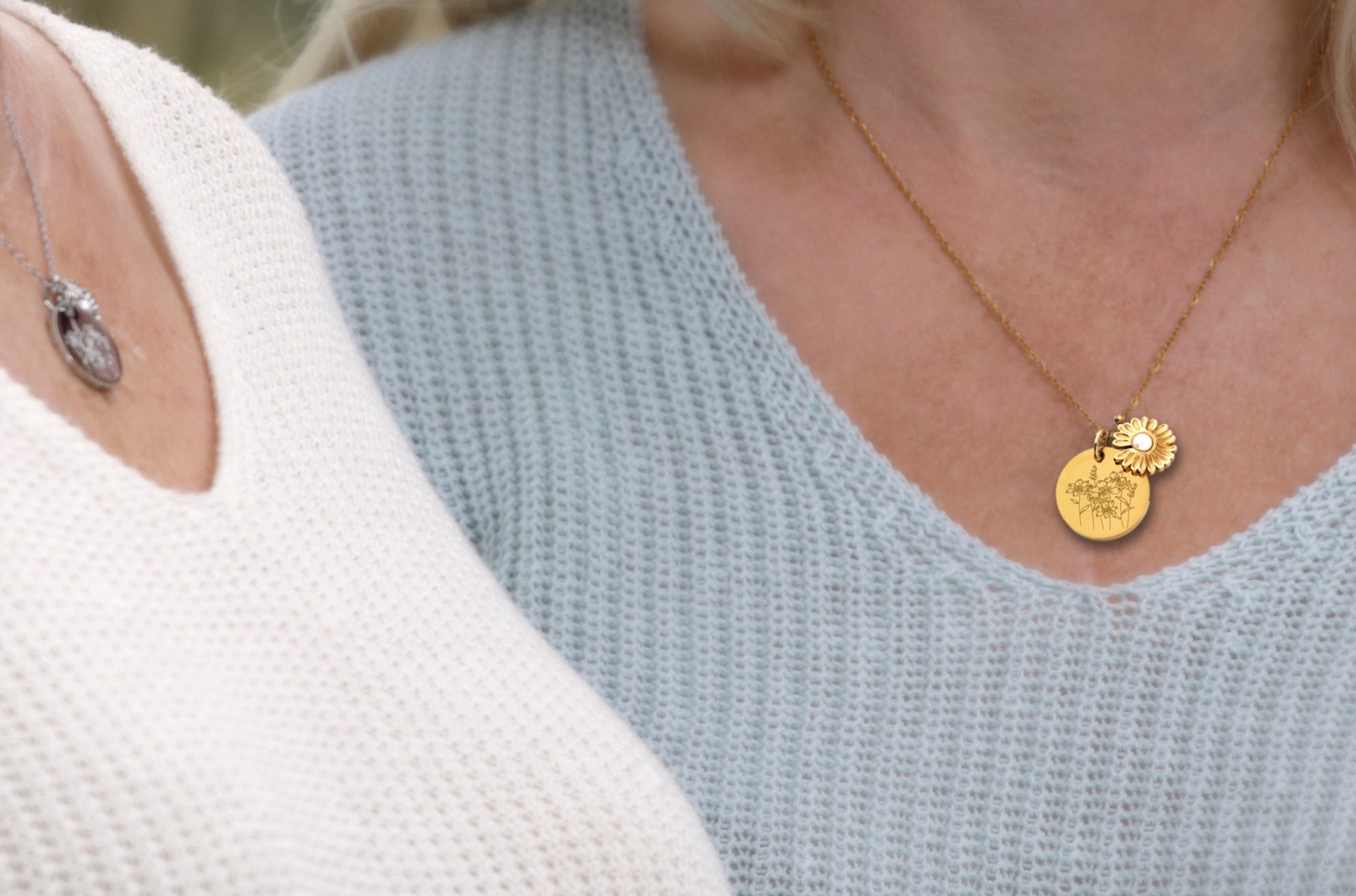 Woman wearing the Prairie Girl Necklace, a prairie-inspired pendant with wildflower engraving and a sunflower charm, perfect for everyday wear.