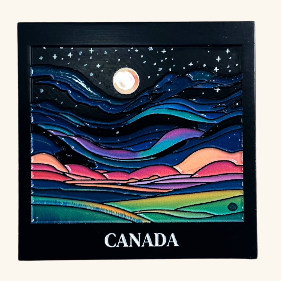 Metal magnet showcasing a vivid illustration of the northern lights dancing across a night sky, capturing the beauty of Canada's Arctic landscape.