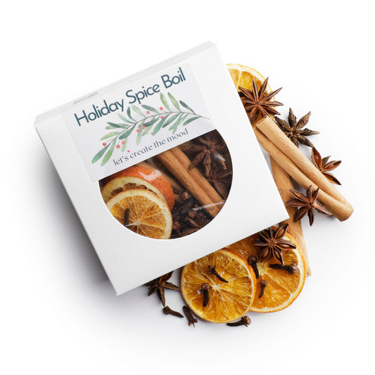 Holiday Spice Boil package with cinnamon sticks, oranges, and star anise on a white background