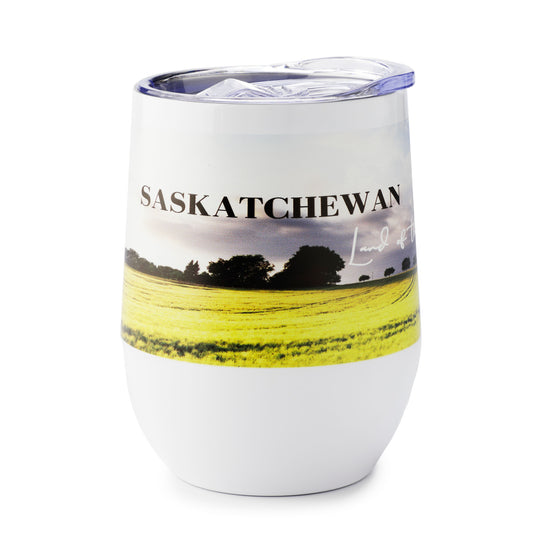 Tumbler with a scenic design of a field and trees, featuring the word 'Saskatchewan'.