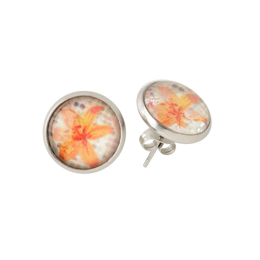 Pair of floral stud earrings on a white background