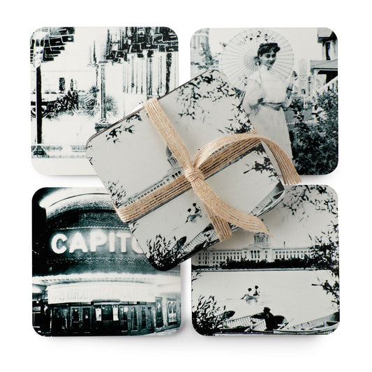 Set of black and white photo coasters tied with a ribbon on a white background