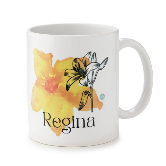 White mug with floral design and 'Regina' text on a white background