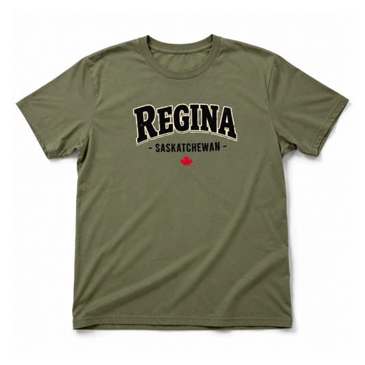 An olive green short-sleeve t-shirt with 'REGINA - SASKATECHWAN' printed in black arched block letters with a white outline on the chest, and a small red maple leaf below, shown on a plain white background.