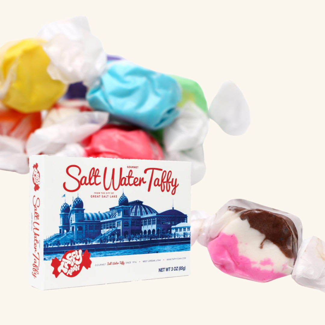 Experience a blast from the past with the perfect selection nastalga candy.

Try an assortment of taffies in Taffy Town's 3 oz. Gift Box! Indulge in flavors like Banana, Grape, Orange Cream, Raspberry, and more. Made in UTAH, USA, (perhaps a new local business opportunity!) these taffies are sure to bring you on an adventure.