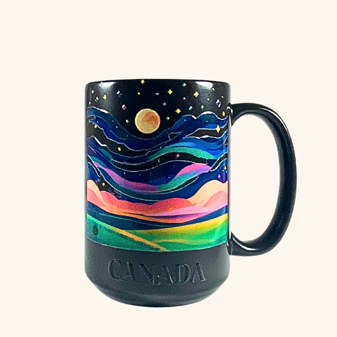 Aurora Borealis Northern Lights Colour-Changing Mug – A 16oz ceramic mug that reveals a vibrant Northern Lights design when filled with hot liquid.