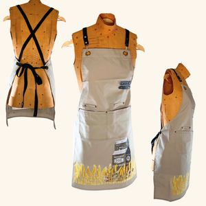 Rustic canvas apron with a Prairie-inspired wheat field and grain elevator illustration, perfect for gardening, cooking, or crafting.