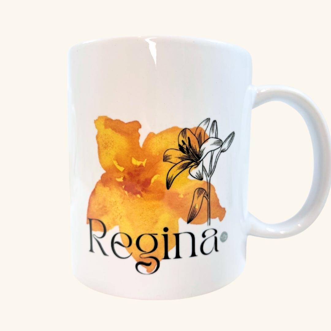 Regina Prairie Lily ceramic mug, featuring a bold illustration of Saskatchewan’s floral emblem, perfect for a Prairie-inspired gift