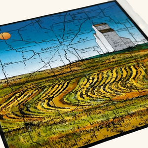 6x6 tile featuring a Saskatchewan grain elevator with a map overlay, blending cartographic and Prairie landscape elements