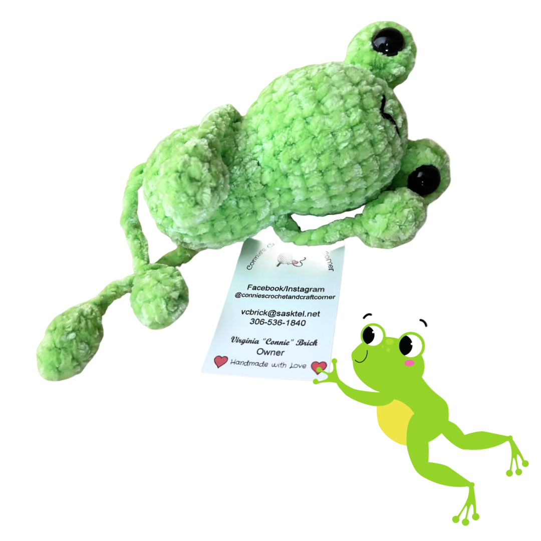 Adorable handmade crochet frog from Connie's Crochet & Craft Corner, featuring tiny details and a playful design.