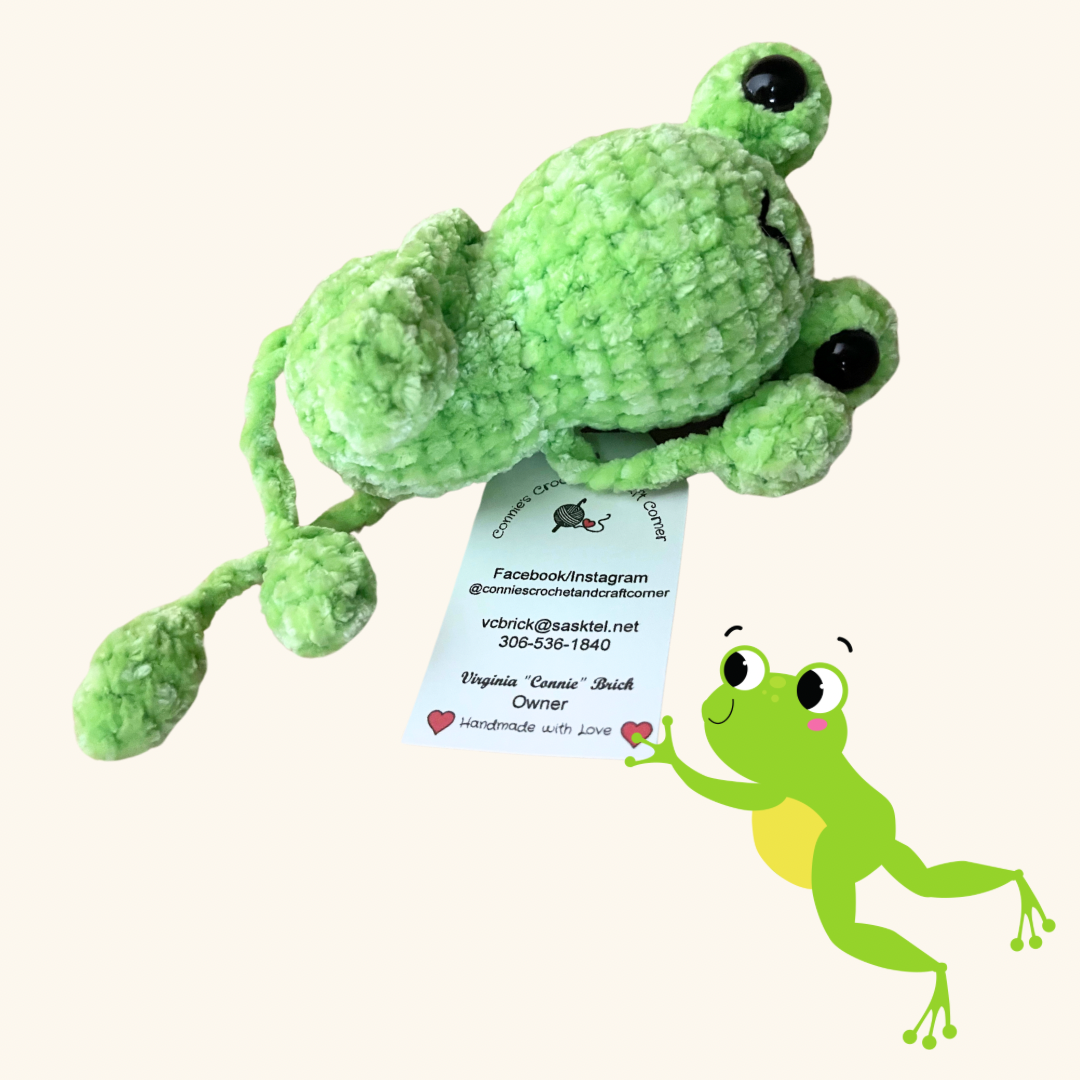 Adorable handmade crochet frog from Connie's Crochet & Craft Corner, featuring tiny details and a playful design.