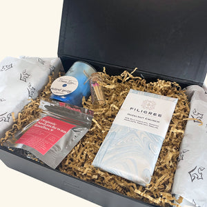 Cozy Night Gift Box – A carefully curated selection of locally made tea, artisan chocolate, a coconut-soy candle, and a glass match holder for the perfect night in.