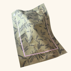 Deluxe cotton tea towel in a soft green shade, offering a luxurious and absorbent kitchen essential.