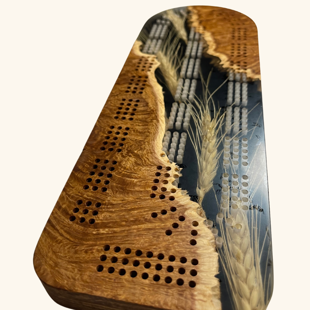 Handcrafted wooden cribbage board by Derevo Designs, featuring a sleek, detailed design perfect for game nights.