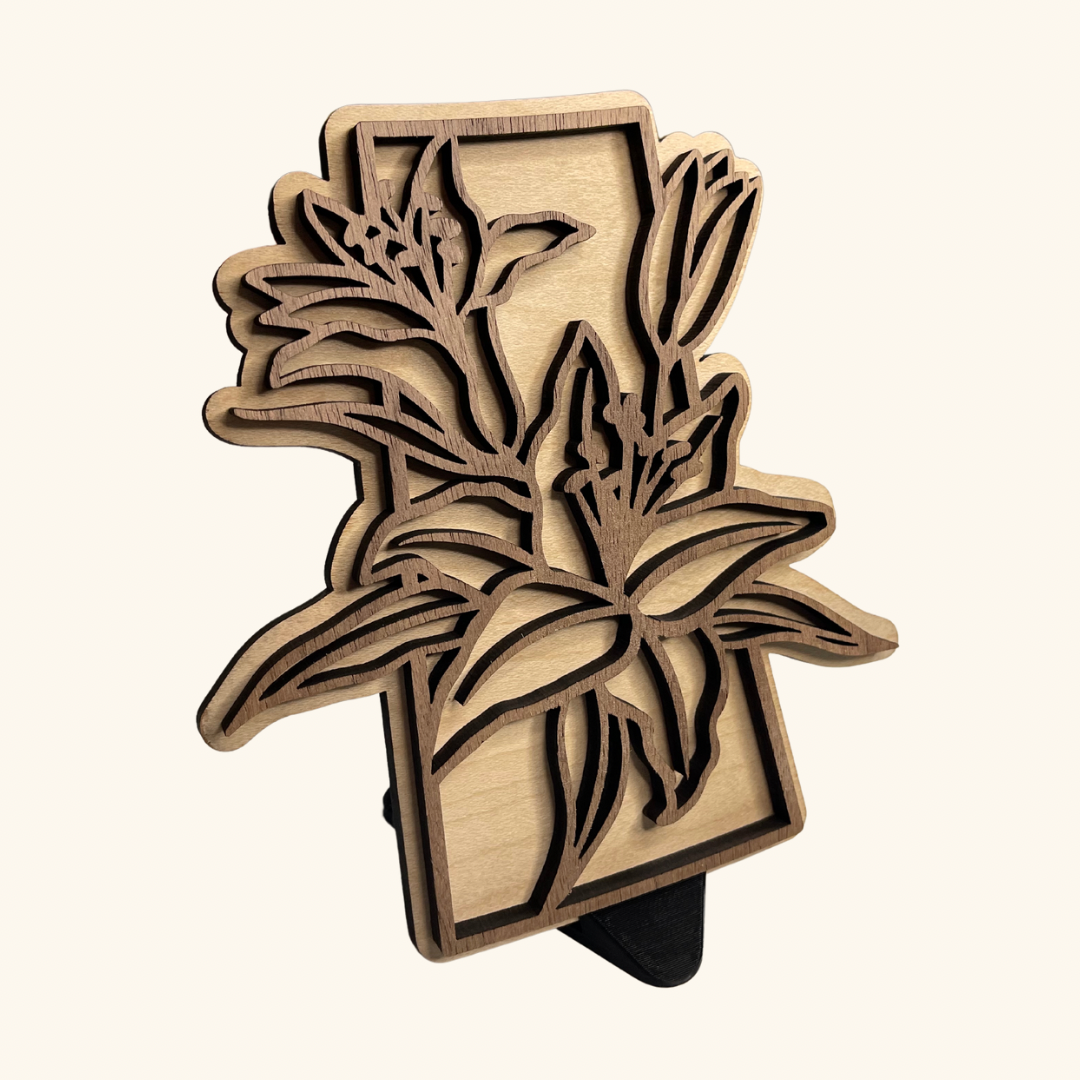 Prairie Lily wood-engraved artwork by Derevo Designs, showcasing Saskatchewan’s iconic flower with fine detail.