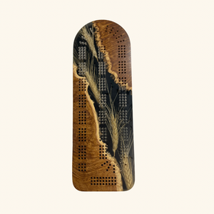 Handcrafted wooden cribbage board by Derevo Designs, featuring a sleek, detailed design perfect for game nights.