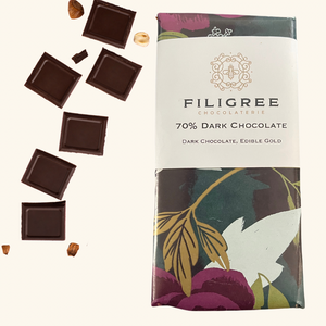 70% dark chocolate bar from Filigree Chocolaterie, elegantly topped with edible gold flakes for a luxurious treat.