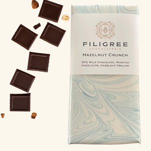 Filigree Chocolaterie hazelnut crunch chocolate bar, featuring smooth milk chocolate with crunchy hazelnut pieces.