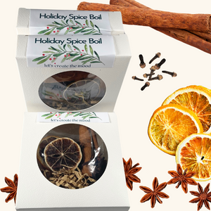 Holiday Spice Boil packaged in a festive box, featuring warm seasonal spices like cinnamon, star anise, and dried oranges for a cozy holiday aroma.