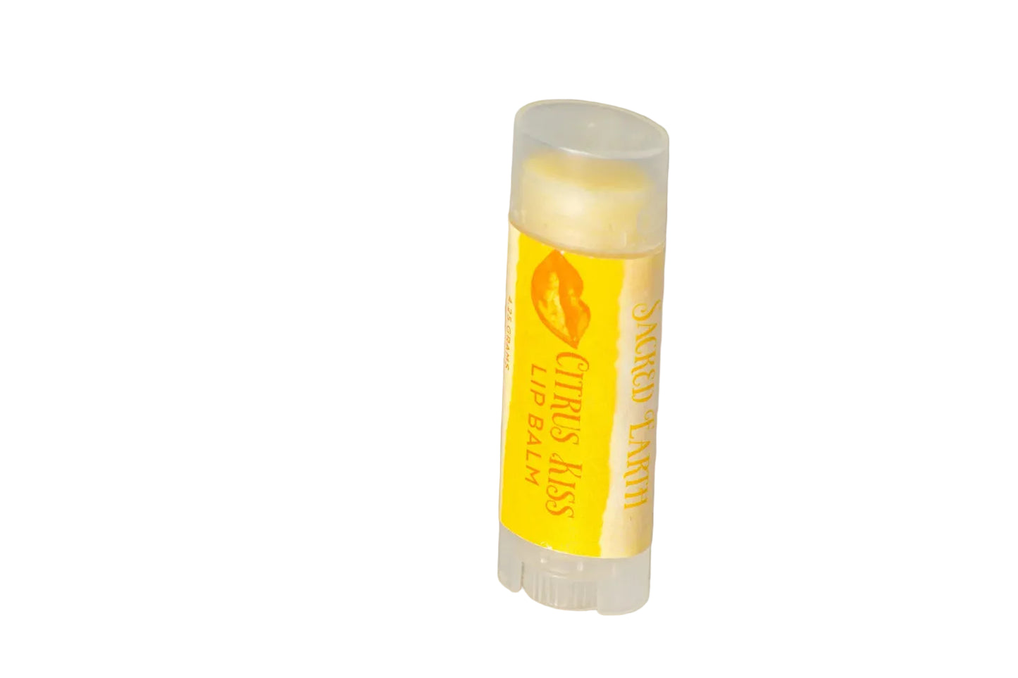 Lip balm stick with yellow label on a tiled floor
