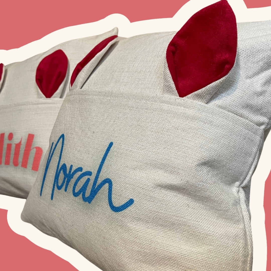 Close-up view of the Bunny Ears custom name pillow, highlighting the soft fabric and personalized embroidered design