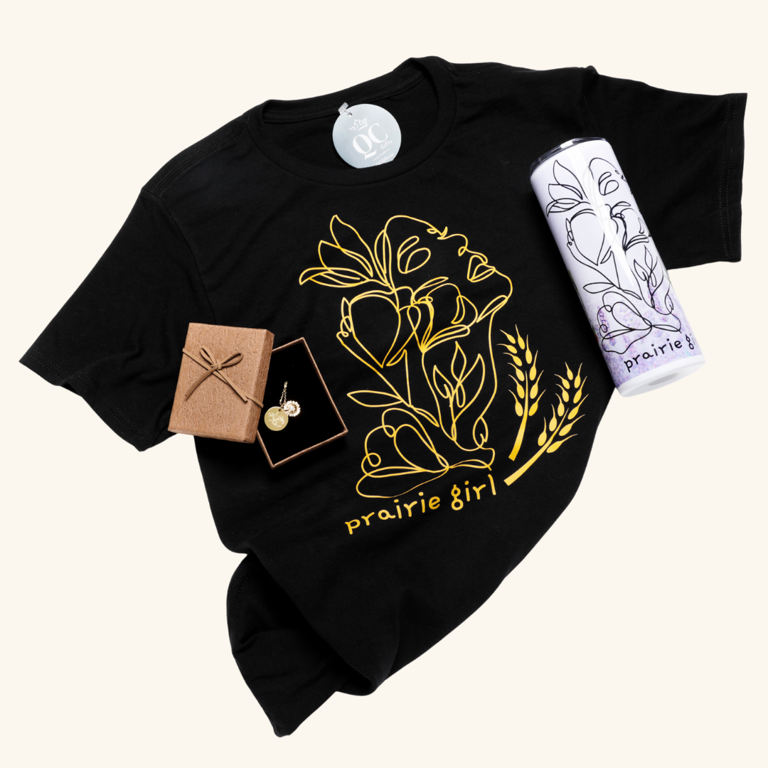 Prairie Girl Gift Box contents – A curated selection including a gold or silver necklace, a Prairie Girl t-shirt, and an insulated skinny tumbler