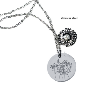 Silver Prairie Girl Necklace – A stainless steel pendant featuring engraved wild prairie flowers and a sunflower charm.