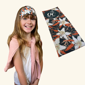 Young girl wearing the Prairie Lily Hairband, a soft and stretchy spandex accessory designed for style and comfort.