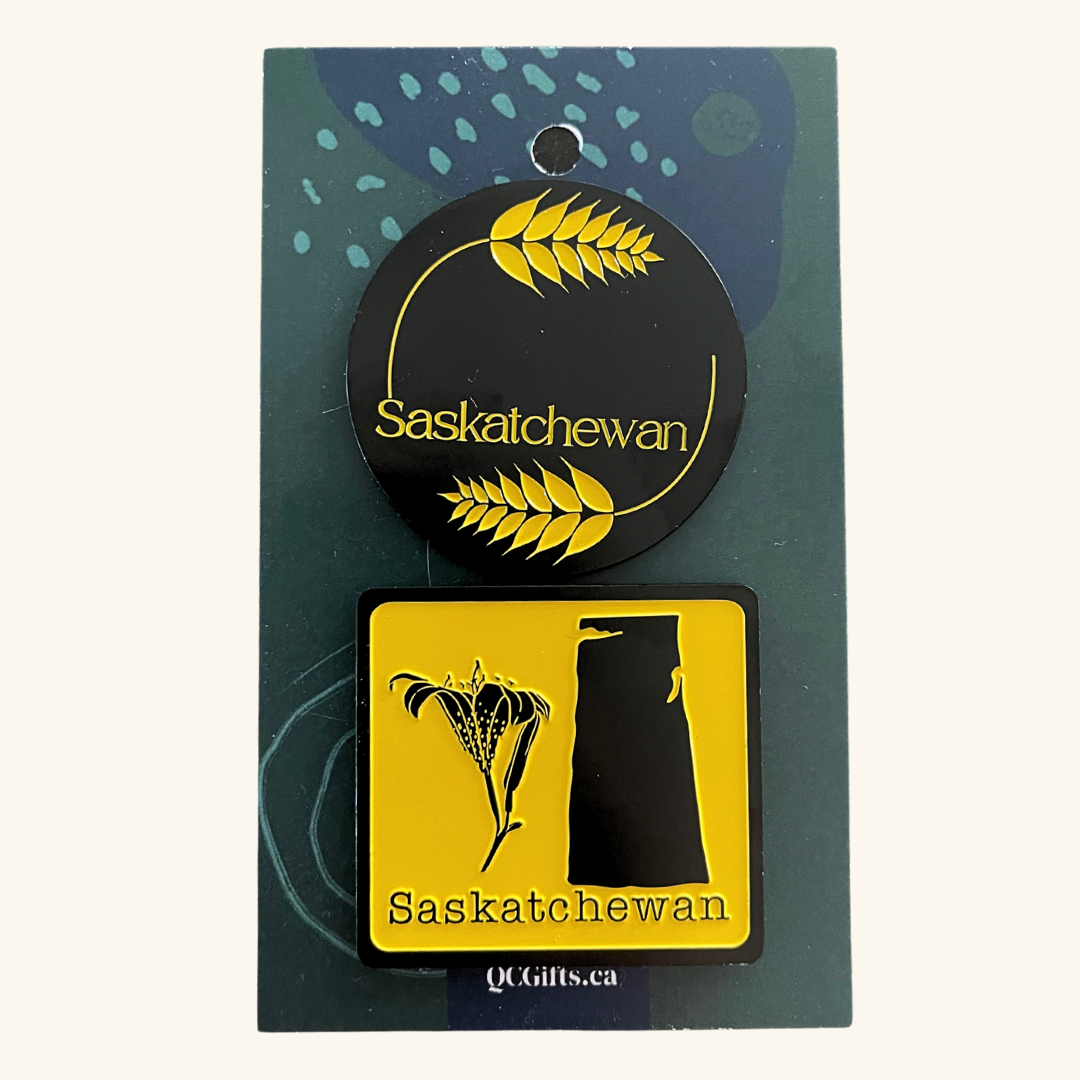 Set of two heavy-duty engraved metal magnets featuring Prairie-inspired designs: one with wheat and the other with a lily and the map of Saskatchewan