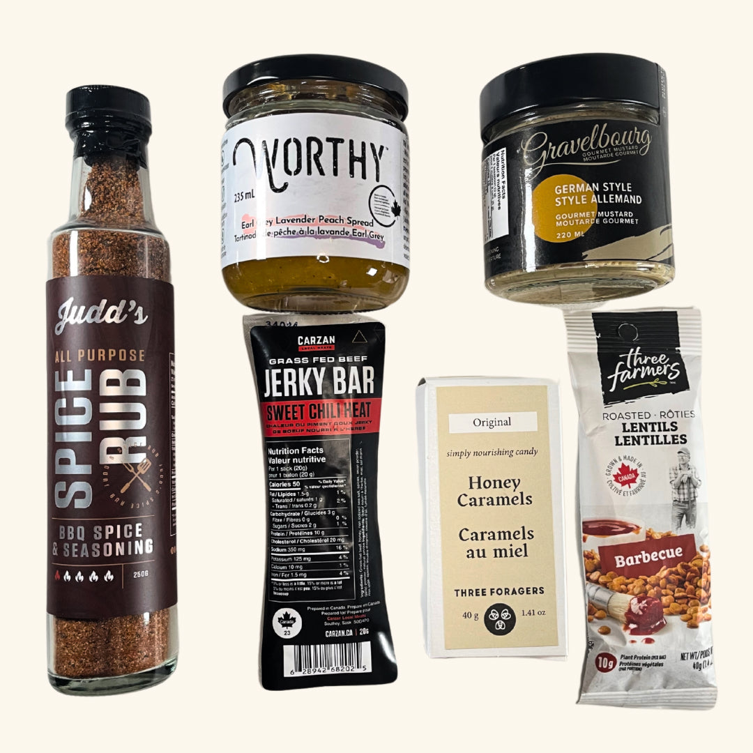 Prairie Tastes Gift Box – A curated collection of Saskatchewan-made gourmet snacks, including beef jerky, mustard, BBQ seasoning, caramel treats, and more.