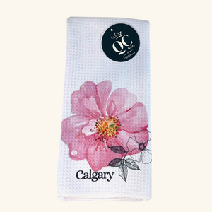 Calgary Wild Rose Tea Towel showcasing Alberta’s provincial flower, adding a floral touch to Prairie kitchen decor.