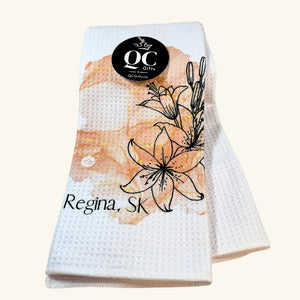 Regina Ink Drop Tea Towel with a unique watercolor-style cityscape design, highlighting the capital of Saskatchewan.