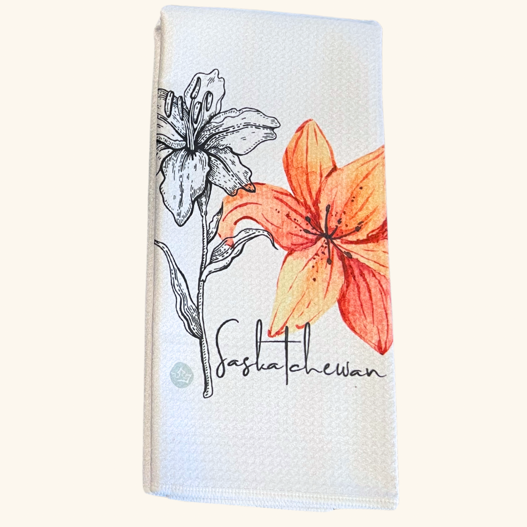 Watercolor-style Saskatchewan Tea Towel featuring a hand-drawn sketch of the province’s landscapes, adding an artistic touch to your kitchen