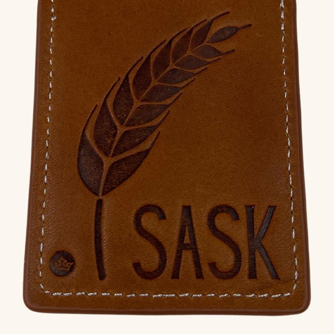 Close-up view of the Prairie Wheat embossed leather luggage tag, showcasing fine details and quality craftsmanship.