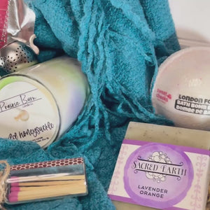 A close-up video showcasing the Relax & Unwind Gift Box and its handcrafted self-care essentials, including tea, soap, and a cozy blanket.