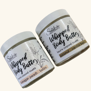 The Sask Bath Co. Body Butter Lotion set featuring Coconut Vanilla and Okanagan Peach Bellini, handcrafted with natural, wild-gathered ingredients