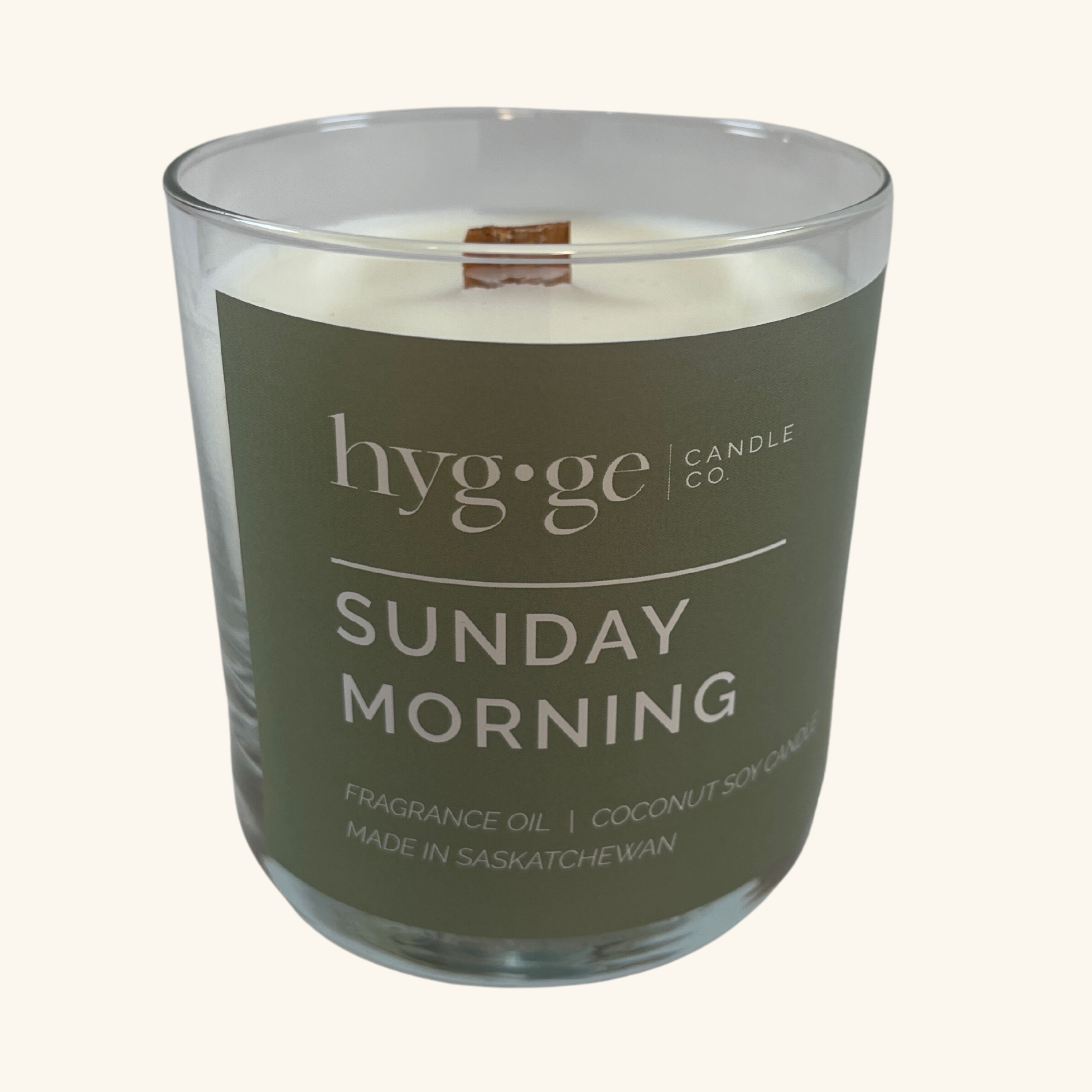 Sunday Morning Candle by Hygge, a 9oz coconut soy wax candle with notes of citrus, gardenia, lilac, and amber, designed for a refreshing burn