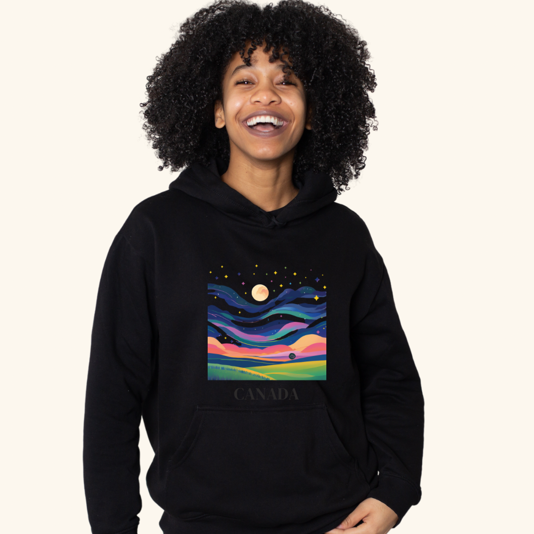 Aurora Borealis Northern Lights Shirt – A black unisex t-shirt featuring a vivid prairie landscape and aurora-inspired sky, worn by a model